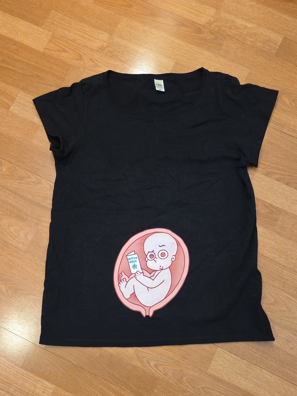 Black Graphic Tee with Pink Fetus Illustration